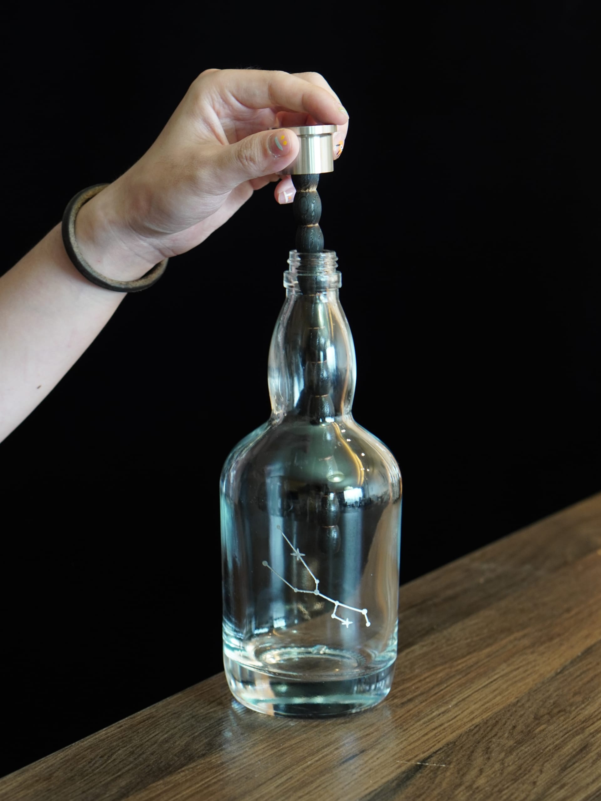 Removing the oak stick from the Aging Bottle