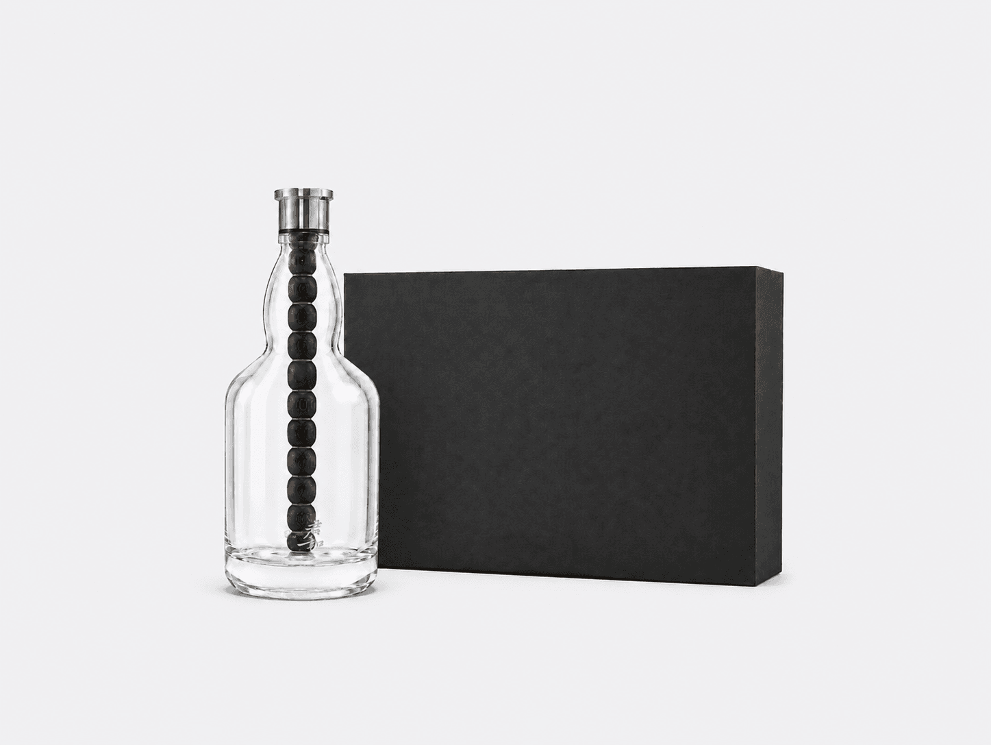 Aging Bottle with its black gift box