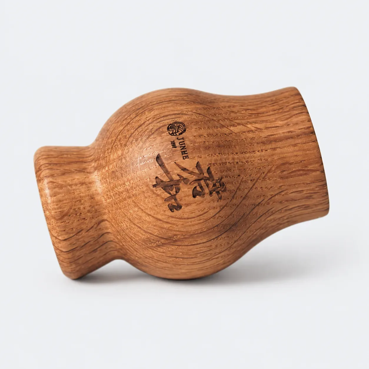 Side view of the engraved oak tasting cup