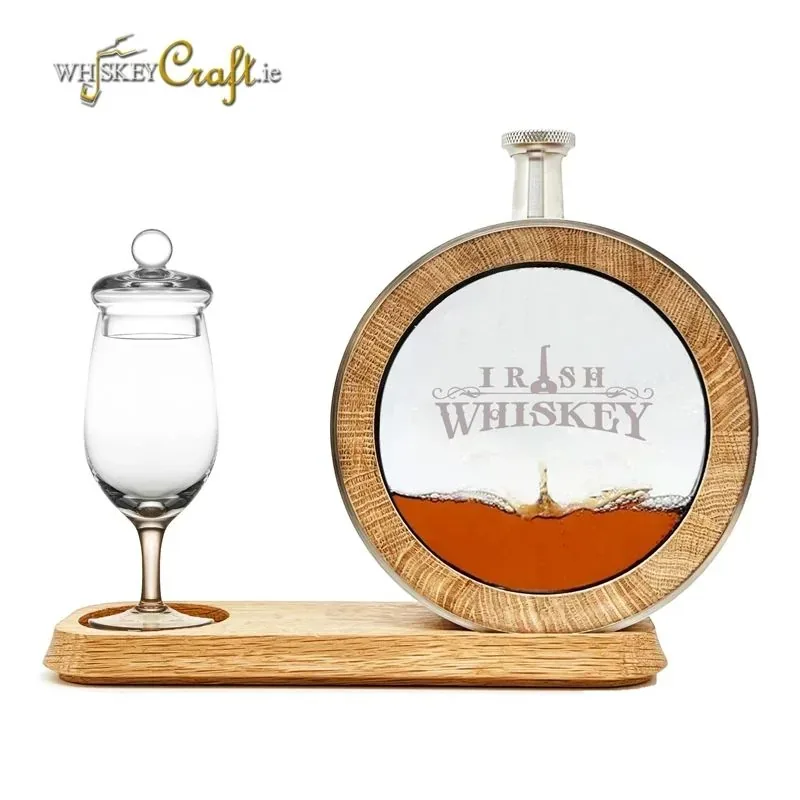 Irish Whiskey — A branded circular decanter with a tasting glass