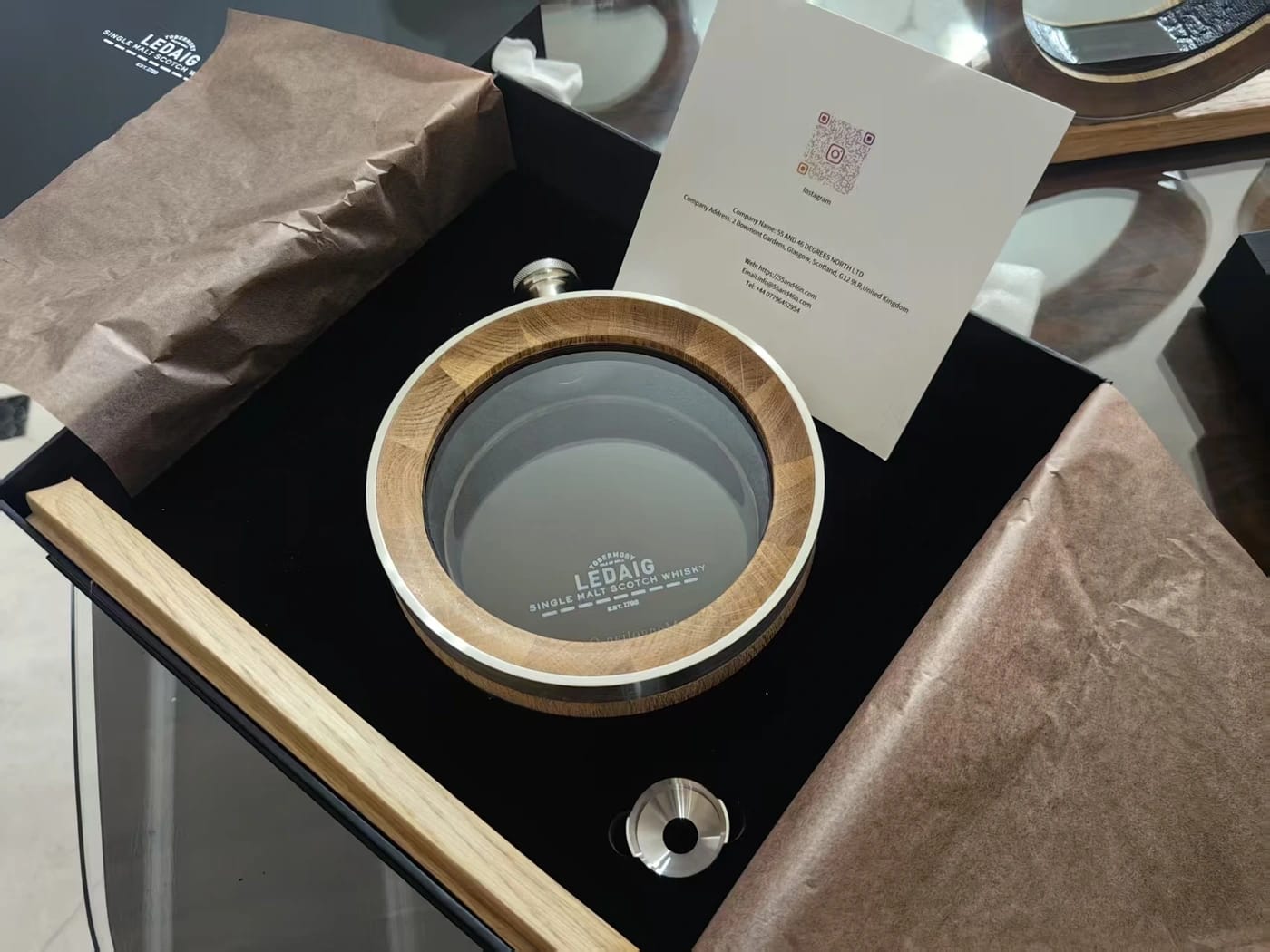 Ledaig — A branded oak decanter with a tasting base and gift packaging