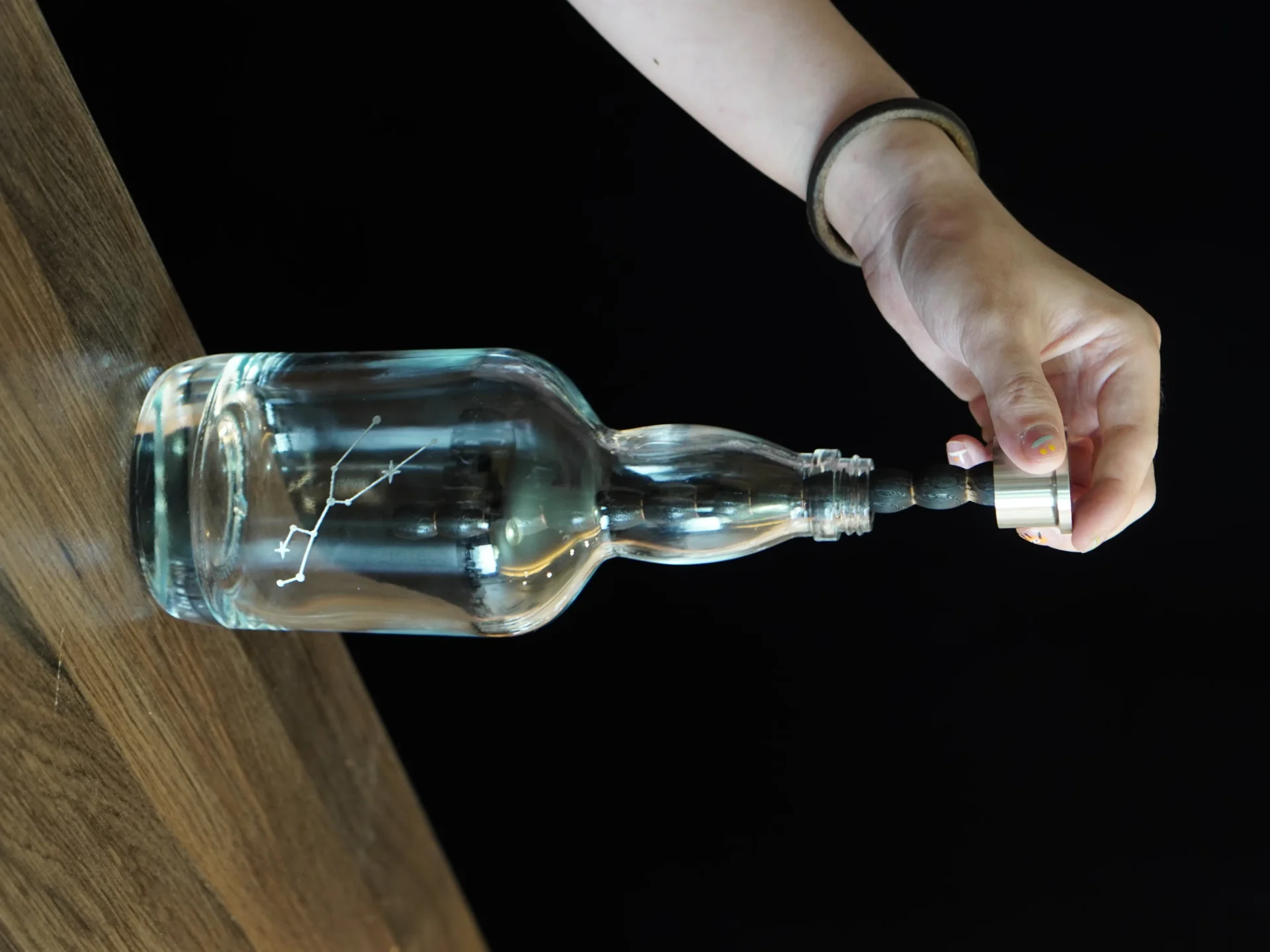 Removing the oak stick from the Aging Bottle