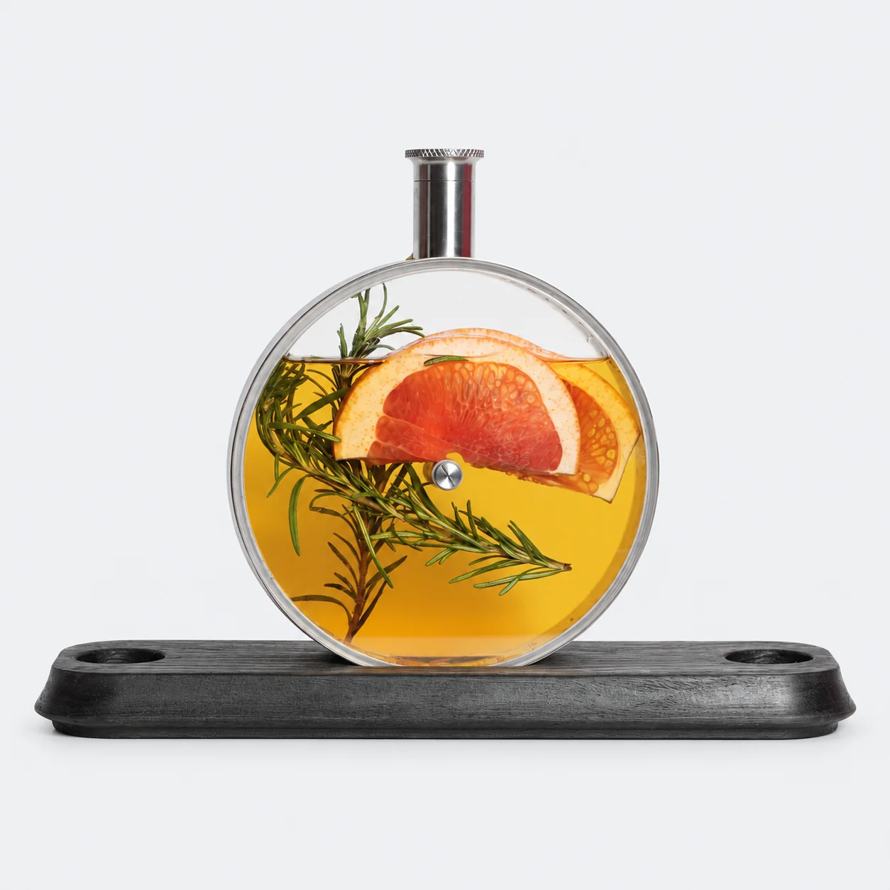 Porthole Infuser with citrus and rosemary on a wooden base