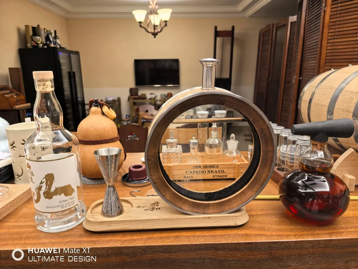 The oak barrel decanter in the bar.