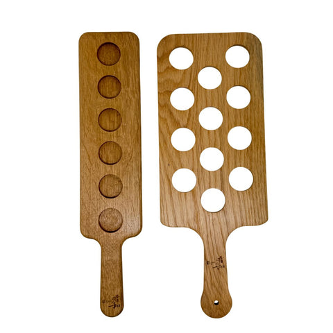 Two oak shot paddles in different shapes.