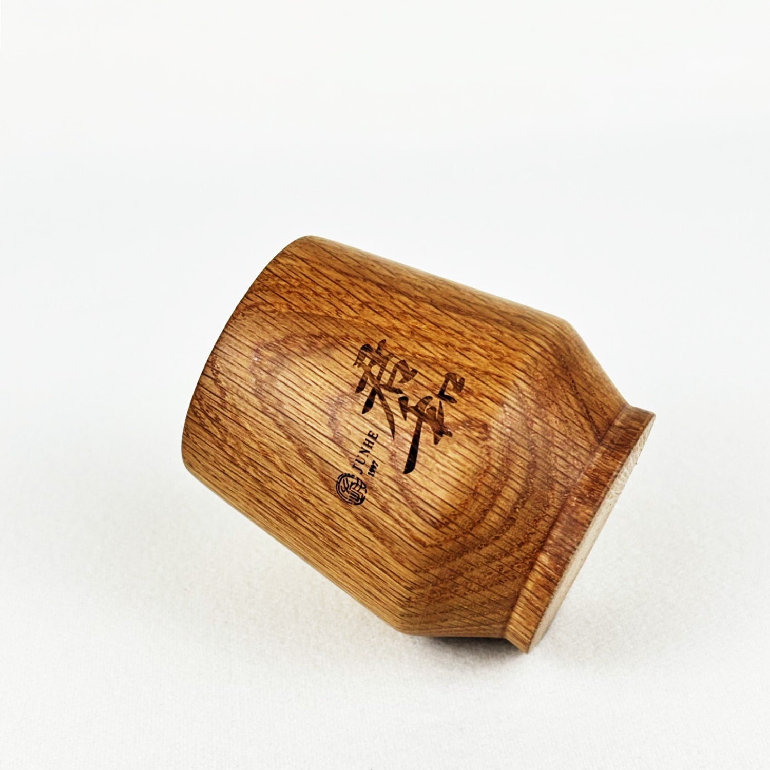 Side detail pictures of oak whiskey cups.