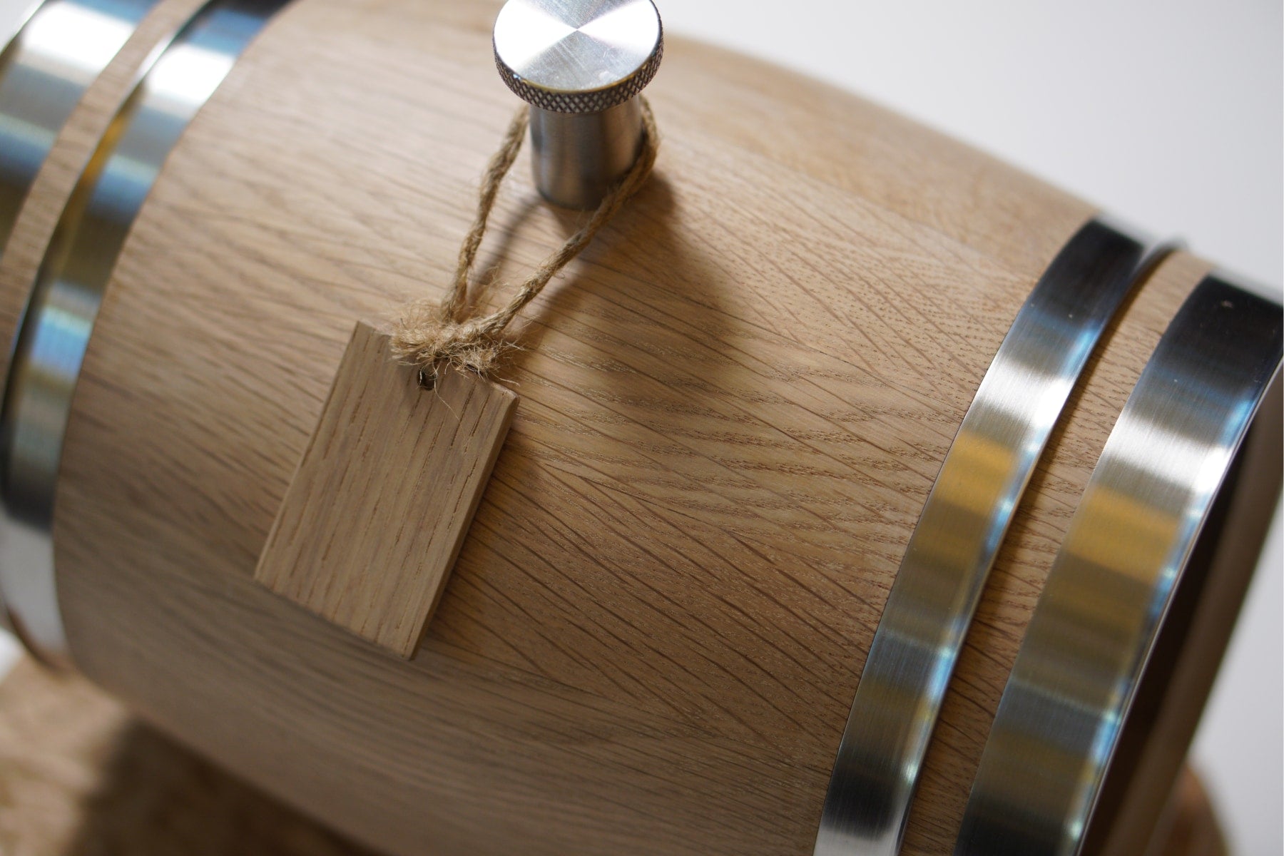 The bottom details of the personalized mini oak whiskey barrel.