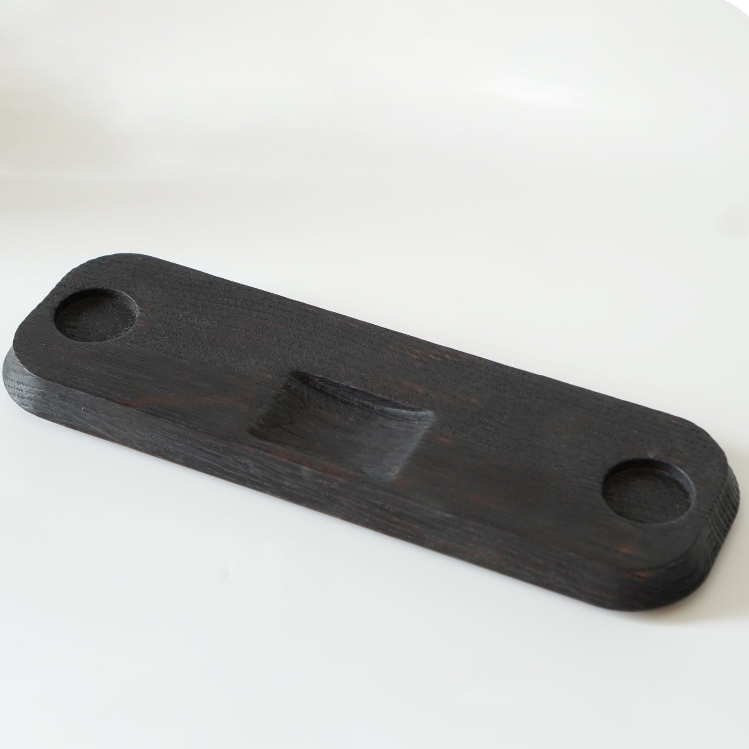 The oak base of the Stainless Steel Porthole Infuser Set. 
